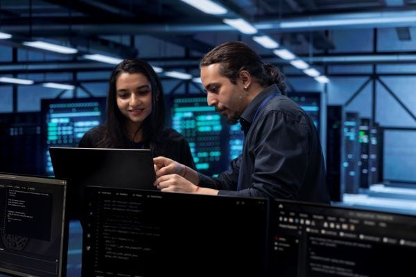 programmers-in-data-center-using-laptop-to-check-f-2025-02-19-23-57-04-utc
