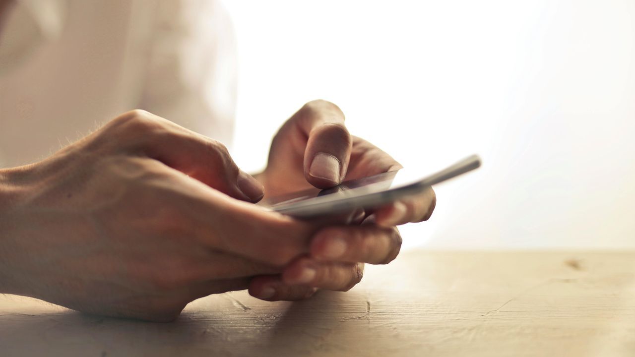 person using a digital wallet on a mobile device