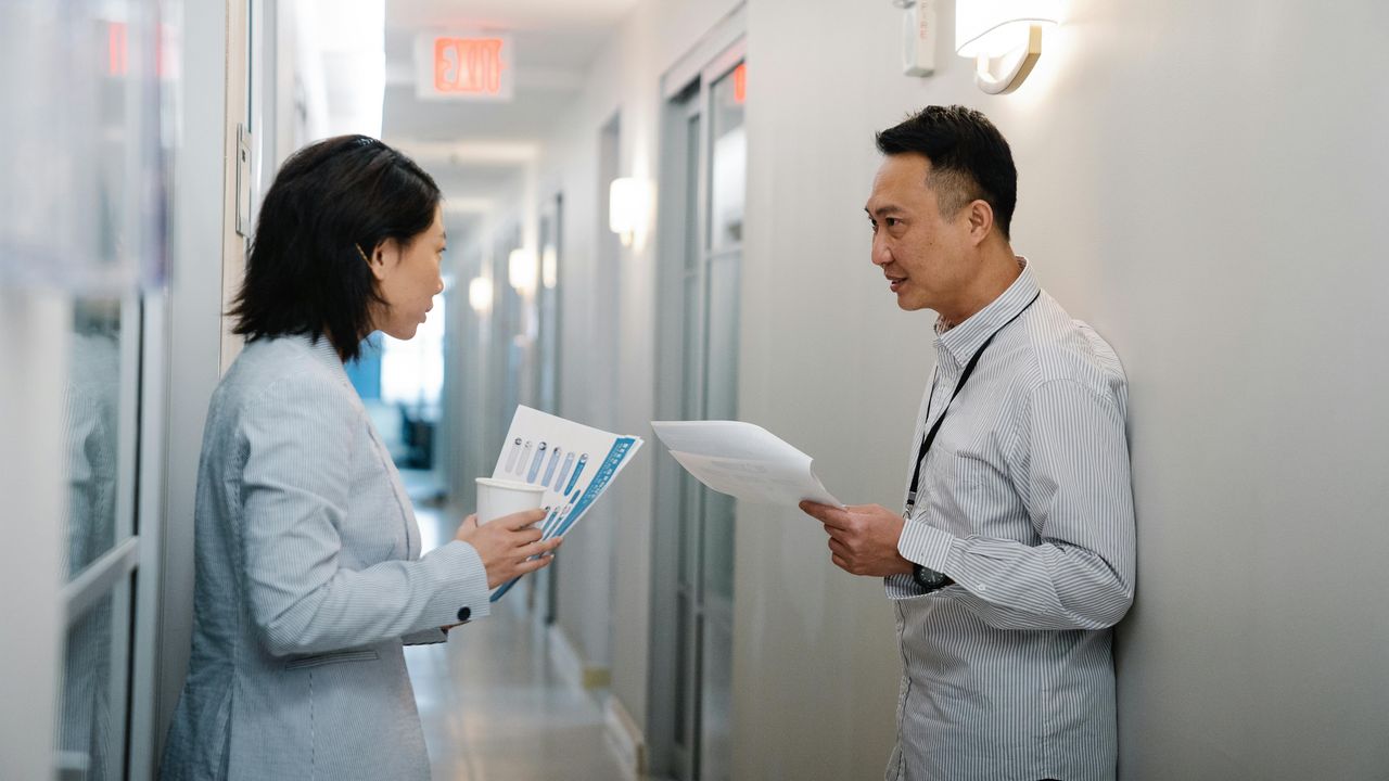 two persons talking to each other