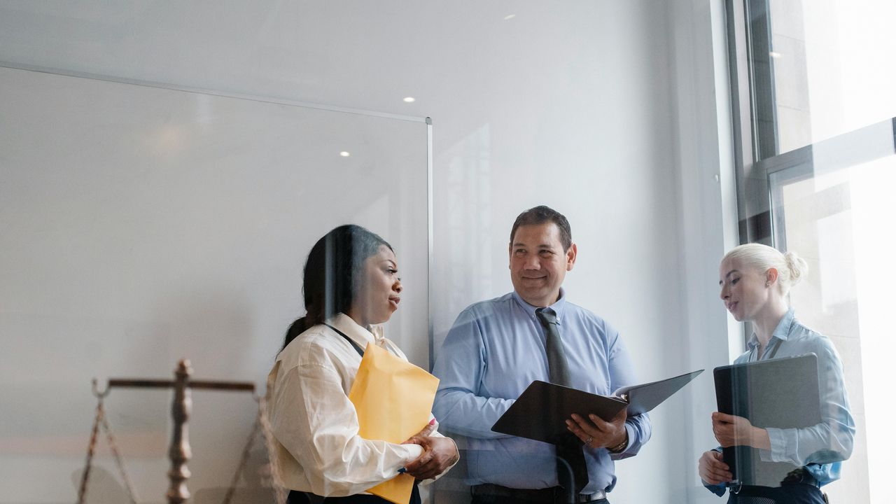 two regulators discussing how they can enforce compliance without compromising privacy
