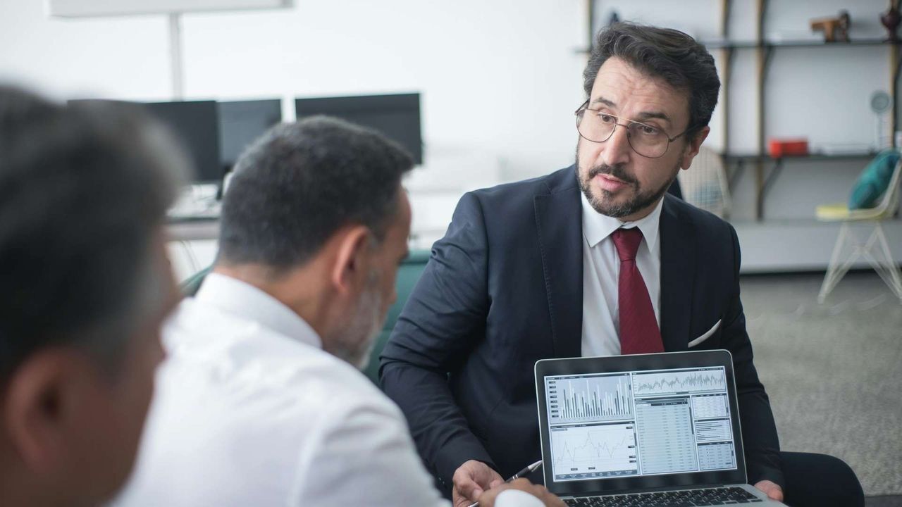Two people working together to talk about cybersecurity and data privacy