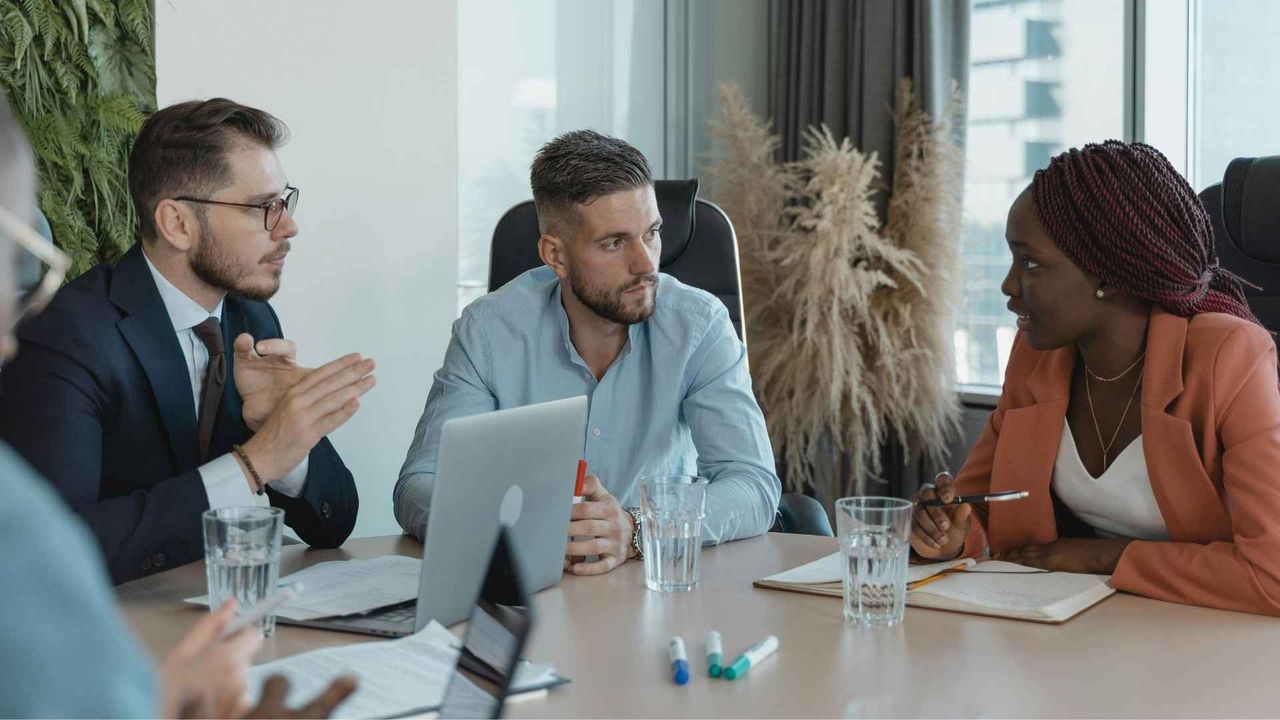 people around a table discussing data privacy